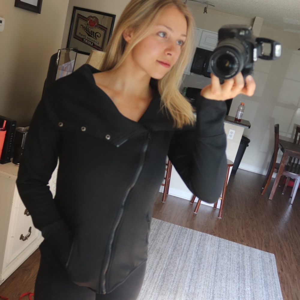 Black zip up sweater.